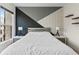 Bedroom featuring a statement wall, contemporary décor, and natural light, creating a cozy and stylish atmosphere at 2076 Holtz Ln, Atlanta, GA 30318