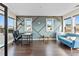 A bright bedroom or office space with wood floors, custom accent wall, and ample natural light at 2076 Holtz Ln, Atlanta, GA 30318