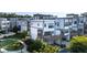 Rear exterior of townhome with elevated deck and manicured lawn and gardens at 2076 Holtz Ln, Atlanta, GA 30318