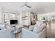 Bright, open-concept living room featuring large windows, modern furnishings and a seamless flow into the kitchen at 2076 Holtz Ln, Atlanta, GA 30318