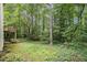 Spacious backyard with deck and stairs in a wooded setting, offering privacy and tranquility at 3420 Cranborne, Marietta, GA 30062