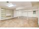 Finished basement with tile floor, support beams, and a built-in bookshelf at 3420 Cranborne, Marietta, GA 30062