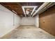 Spacious unfinished basement area with exposed ceiling, concrete floor, and white-painted walls at 3420 Cranborne, Marietta, GA 30062