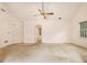 View of a spacious bedroom with a ceiling fan and doorway to a bathroom at 3420 Cranborne, Marietta, GA 30062
