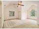 Spacious bedroom with vaulted ceiling, ceiling fan, neutral carpet, and large windows at 3420 Cranborne, Marietta, GA 30062