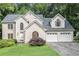 Charming two-story stucco home with a well-manicured lawn and an attached two-car garage at 3420 Cranborne, Marietta, GA 30062