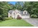 Charming two-story stucco home with a well-manicured lawn and an attached two-car garage at 3420 Cranborne, Marietta, GA 30062