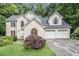 Charming two-story stucco home with a well-manicured lawn and an attached two-car garage at 3420 Cranborne, Marietta, GA 30062