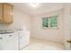 Laundry room with washer, dryer, cabinet storage, and natural light at 3420 Cranborne, Marietta, GA 30062