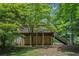 A lovely backyard with a deck and staircase provides a peaceful outdoor place surrounded by greenery at 3611 Winfair Pl, Marietta, GA 30062