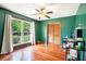 Bright bedroom with hardwood floors, large window, and a ceiling fan at 3611 Winfair Pl, Marietta, GA 30062