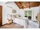 Bright bedroom with a vaulted wood ceiling, ceiling fan and sliding glass doors to a private balcony at 3611 Winfair Pl, Marietta, GA 30062