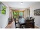 Cozy dining room with sliding glass doors to deck and backyard views, perfect for entertaining at 3611 Winfair Pl, Marietta, GA 30062