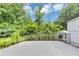 Landscaped backyard view from the rear deck featuring iron railings and mature trees providing privacy at 851 Flagler Se Cir, Smyrna, GA 30080