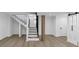 Spacious basement featuring a modern staircase, open layout, light wood floors, and a stylish accent wall at 851 Flagler Se Cir, Smyrna, GA 30080