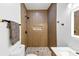Modern bathroom featuring a beautifully tiled shower with a built-in niche and sleek black fixtures at 851 Flagler Se Cir, Smyrna, GA 30080