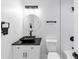 Stylish bathroom featuring a modern black vessel sink, granite countertop, and sleek fixtures at 851 Flagler Se Cir, Smyrna, GA 30080