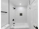 All-white bathroom showcasing modern fixtures, sleek lines, and a tiled shower-tub combination at 851 Flagler Se Cir, Smyrna, GA 30080