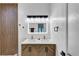 Bright primary bathroom featuring a double vanity, modern fixtures, a walk-in shower, and attractive wood accents at 851 Flagler Se Cir, Smyrna, GA 30080