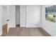 Cozy bedroom with wood floors, a window view, closet with sliding door and white trim at 851 Flagler Se Cir, Smyrna, GA 30080