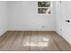 Bright bedroom featuring wood floors and a window with natural light at 851 Flagler Se Cir, Smyrna, GA 30080