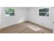 Inviting bedroom with hardwood flooring, two windows with green views and white walls at 851 Flagler Se Cir, Smyrna, GA 30080