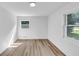 Sunlit bedroom featuring wood-look floors, white trim, and neutral walls at 851 Flagler Se Cir, Smyrna, GA 30080