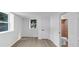 This bright bedroom features new flooring and two windows, adjacent to a bathroom with a tile wall and toilet at 851 Flagler Se Cir, Smyrna, GA 30080