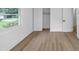 Minimalist bedroom with wood floors, a closet and window offering natural light and neighborhood views at 851 Flagler Se Cir, Smyrna, GA 30080