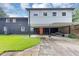 Exterior of the home features a two-story section with an orange front door and carport at 851 Flagler Se Cir, Smyrna, GA 30080