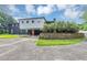 Home exterior featuring a multi-story design, carport, and landscaping in the front yard at 851 Flagler Se Cir, Smyrna, GA 30080