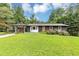 Charming, renovated ranch-style home with a manicured lawn, stylish black brick, and a delightful splash of color on the front door at 851 Flagler Se Cir, Smyrna, GA 30080