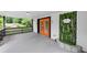 Inviting front porch with striking orange double doors and a charming vertical garden, perfect for relaxing outdoors at 851 Flagler Se Cir, Smyrna, GA 30080