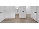 Bright hallway featuring sleek modern floors and crisp white walls with views of a bathroom and adjacent rooms at 851 Flagler Se Cir, Smyrna, GA 30080