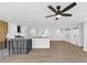 Bright, open kitchen features stainless appliances, white cabinetry, a ceiling fan and an eat-in island at 851 Flagler Se Cir, Smyrna, GA 30080