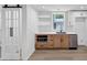 Basement kitchenette with stainless appliances, floating shelves, undermount lighting and sliding barn doors at 851 Flagler Se Cir, Smyrna, GA 30080