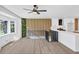 Modern living room open to the kitchen area, featuring stylish hardwood floors and plenty of natural light at 851 Flagler Se Cir, Smyrna, GA 30080