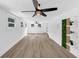 Bright and airy living room with large windows, modern ceiling fan and wood flooring create a comfortable inviting space at 851 Flagler Se Cir, Smyrna, GA 30080