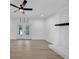 Bright and open living room features white brick fireplace, natural lighting and hardwood floors at 851 Flagler Se Cir, Smyrna, GA 30080