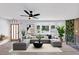 Bright and airy living room featuring hardwood floors, a large sectional sofa, a bay window, and a unique vertical garden at 851 Flagler Se Cir, Smyrna, GA 30080
