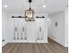 An open room with wood laminate floors, barn doors, and recessed lighting is bright and spacious at 851 Flagler Se Cir, Smyrna, GA 30080