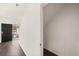 Entryway with hardwood floors, black front door, and hall closet at 12071 Conrad Cir, Hampton, GA 30228