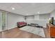 Finished basement with wood flooring, recessed lighting, and modern grey paint at 131 Banyon Ct, Dallas, GA 30157