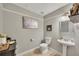 Well-lit bathroom features a toilet, vanity, and shower at 131 Banyon Ct, Dallas, GA 30157