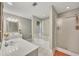 The primary bathroom has dual vanities, tile floors, and a glass-enclosed shower at 131 Banyon Ct, Dallas, GA 30157