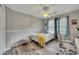 Cozy bedroom with hardwood floors, ceiling fan, and natural light from the window at 131 Banyon Ct, Dallas, GA 30157