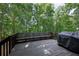 Back deck with built-in seating, ideal for outdoor relaxation and grilling at 131 Banyon Ct, Dallas, GA 30157
