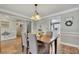 Comfortable dining room featuring wood floors, grey walls and soft accents at 131 Banyon Ct, Dallas, GA 30157