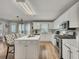 Bright kitchen with a center island, white cabinetry, and stainless steel appliances at 131 Banyon Ct, Dallas, GA 30157