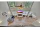 Vaulted living room with wood flooring, large windows, and a cozy fireplace at 131 Banyon Ct, Dallas, GA 30157